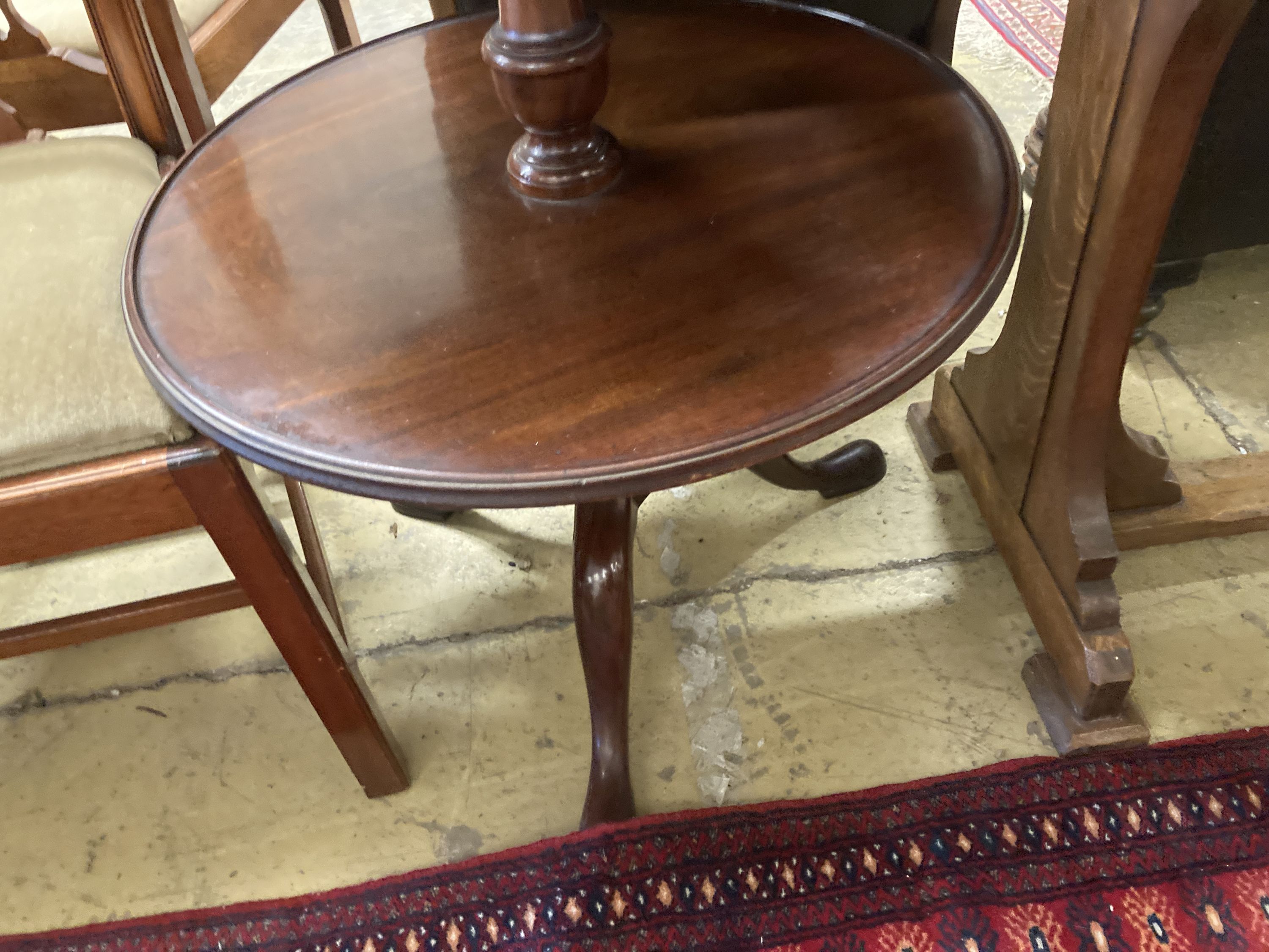 A Georgian mahogany revolving three tier dumb waiter, height 100cm